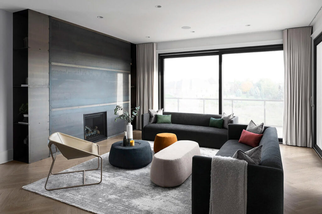 Modern living room with large windows and recessed lighting by G&S Electric in London, Ontario