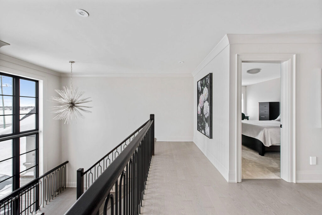 Modern hallway with staircase pendant lighting by G&S Electric in London, Ontario